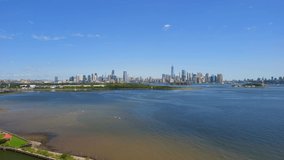 This video shows gorgeous aerial views of Jersey City and New York City Skyline over the Hudson River. 