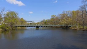 This video shows beautiful aerial views of a bridge crossing at the Peddie River in hightstown, NJ.   