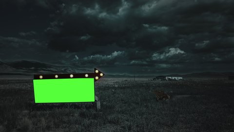 Green Screen Billboard Arrow Sign Flashing Lights Countryside Zoom In. A small billboard green screen with a flashing lights arrow sign standing on the countryside under at night