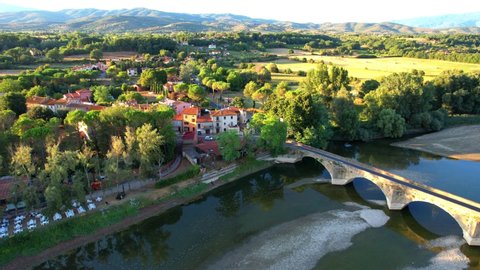 Aerial wiev drone bridge built in 1240 painted on Leonardo Da Vinci Mona Lisa. Situated in the middle of Tuscany surrounded by trees above Arno river. Landscape, Village, Natural reserve, flight wiev.