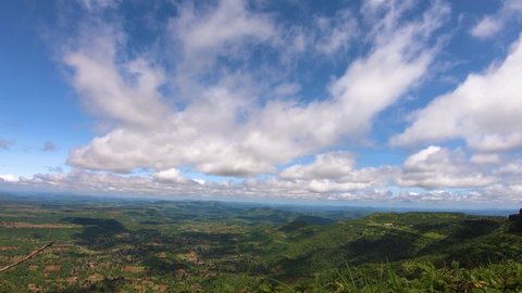 4K Time-lapse of clouds above the valley as seen from the top of the Governer Hill at Saputara in Gujarat, India. Shadows of the clouds move in the land of the valley.