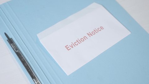 Adding moratorium sticker on Eviction notice - concept showing of protecting evictions using moratorium during coronavirus or covid-19 pandemic.