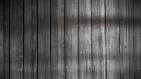 video clip features a wooden planks background with natural lights and shadows 
