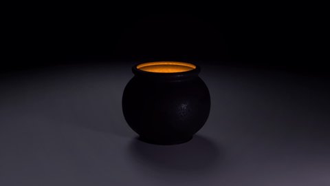 Cauldron of Witch with yellow light and copy space in Smoky dark Full HD footage for Halloween or event with Magic. 3D animation with lighting Pot and smoke. Dissolve transition in the end.