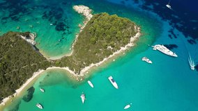Aerial drone video of iconic port and fishing village of Lakka with traditional Ionian architecture a safe anchorage for yachts and sail boats, Paxos island, Ionian, Greece