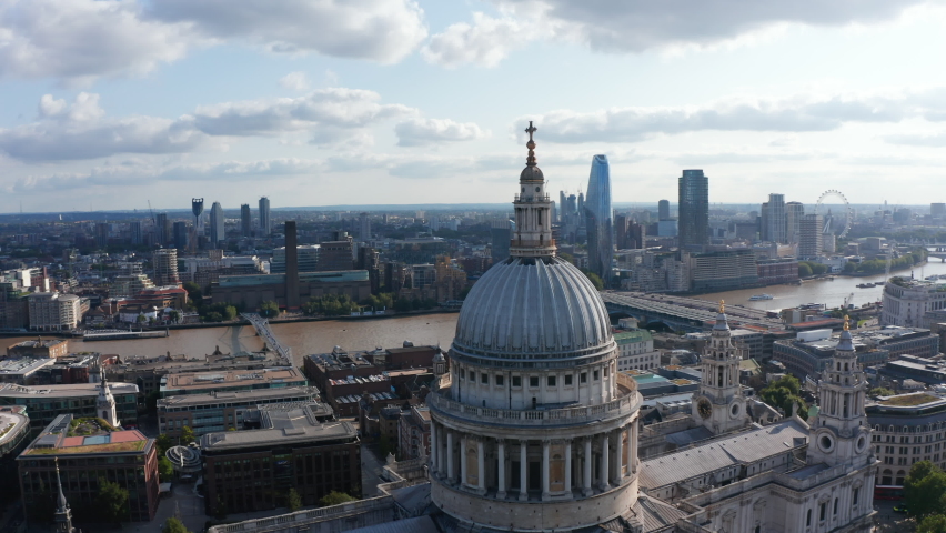 Tight fly around top of Saint Pauls Cathedral. Aerial view of River Thames and its south bank with Tate Modern art gallery and One Blackfriars skyscraper. London, UK Royalty-Free Stock Footage #1078997768