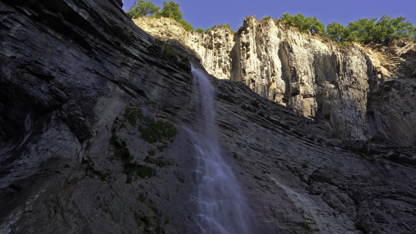 Images of the Sorrosal waterfall, in Broto, Pyrenees. The waterfall has a jump of about 100 meters divided into two sections.  It is formed by the action of the ice of a glacier.