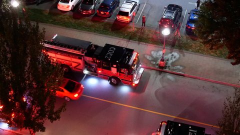 Coquitlam, BC, Canada - September 01, 2021 : Top shot of fire truck light at dark night in Coquitlam BC Canada with 4k resolution