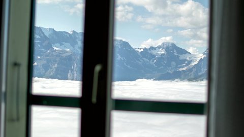 4K Window Timelapse of Jungfrau and clouds above Lauterbrunnen Valley from Schynige Platte, Switzerland