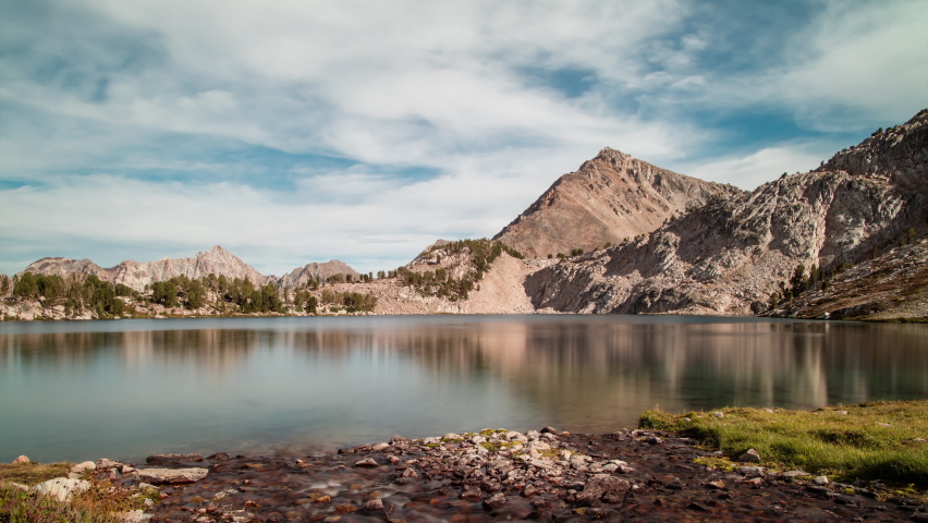 Day to night to day time-lapse of Sapphire Lake in the Cecil D. Andrus-White Clouds Wilderness, part of the Sawtooth National Forest in Idaho. Royalty-Free Stock Footage #1079034815