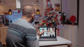 Woman interrupting business video call for man working on christmas eve, to celebrate seasonal holiday. Adult using online conference for work meeting while impatient partner waiting on celebration - Powered by Shutterstock - Get 15% off with code: PIKWIZARD15