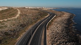 Coast road Malta Drone Aerial Footage cars passing by 