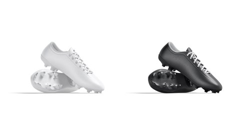 Blank black and white soccer boots mockup pair, looped rotation, 3d rendering. Empty professional training shoes mock up, 4k video, isolated. Clear leather footwear with spikes template.