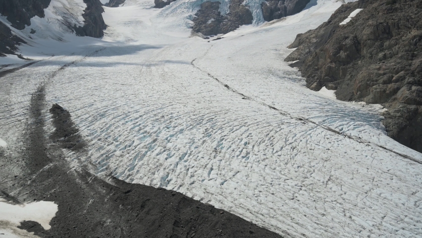 4K video tilt up to reveal massive glacier full of ice on the slopes of a tall mountain in Olympic National Park, Washington