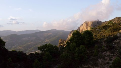 Aerial view of the Cabezo D'Or mountain. A granite summit with spectacular cliffs and rock strata, in Alicante, Spain.