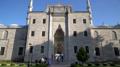 Istanbul, Turkey - September 2021: Tourists visiting Suleymaniye Mosque. The entrance gate of Suleymaniye Mosque in Eminonu district