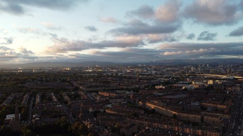 30 second 4k straight line shot over British City. This drone shot moves slowly over the industrial city in a straight line, which gives it a calm, cinematic feel. Warm sunlight is visible on