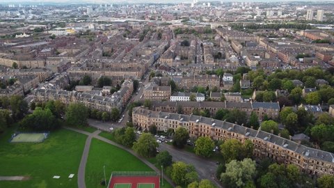 Glasgow, UK, 13092021. Starting on the edge of Queens Park, Glasgow, this 4k, smooth, straight line fly over drone shot makes it's way north over Govanhill