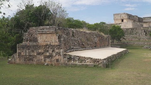UXMAL, MEXICO - CIRCA 2021: Ruins of "Pok-ta-pok" sport court in ancient Mayan city of Uxmal, Yucatan. Panning shot.