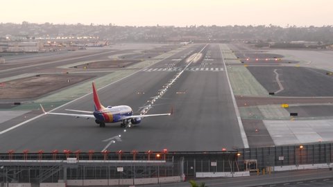 San Diego, California USA - 24 Nov 2020: Southwest Airlines plane on international airport runway, airplane on Lindbergh Field airstrip. Aircraft on aerodrome or airfield. Passenger airliner departure