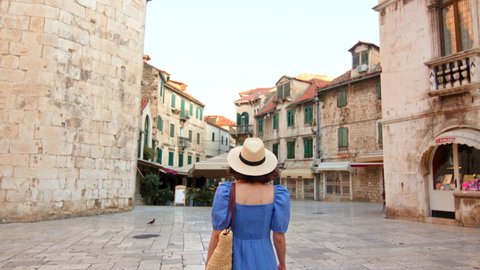 Young girl in a hat in the city on vacation. Croatia, Split