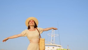 Happy woman with ship mast on sky background