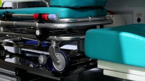 the interior of an ambulance or intensive care unit with a retractable stretcher for carrying the patient. Dolly video