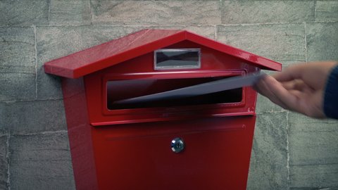 Posting Letter And Package Into Mail Box