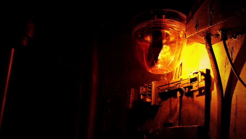 Light Flashing In Dark Industrial Area - Looped Shot