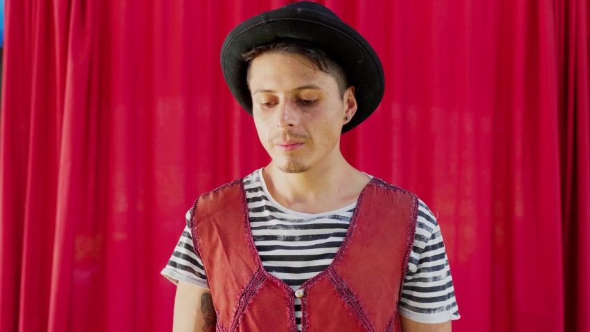 Portrait of serious circus artist with hat