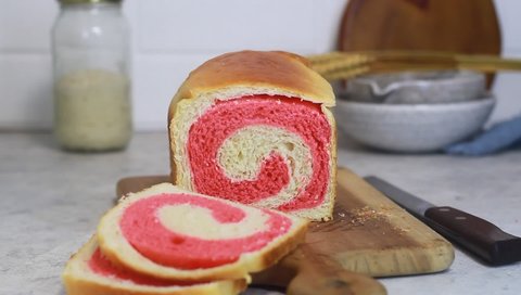Swirl pattern of slicing strawberry sourdough swirl bread, sandwich bread Preparation Baking at Home. Selective focus grainy blurred for clip background