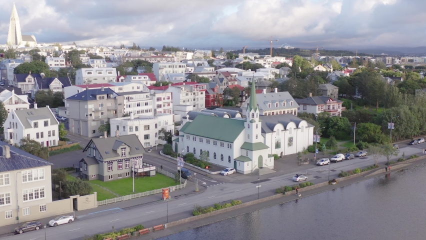 Idyllic Iceland church in downtown Reykjavik, white traditional buildings