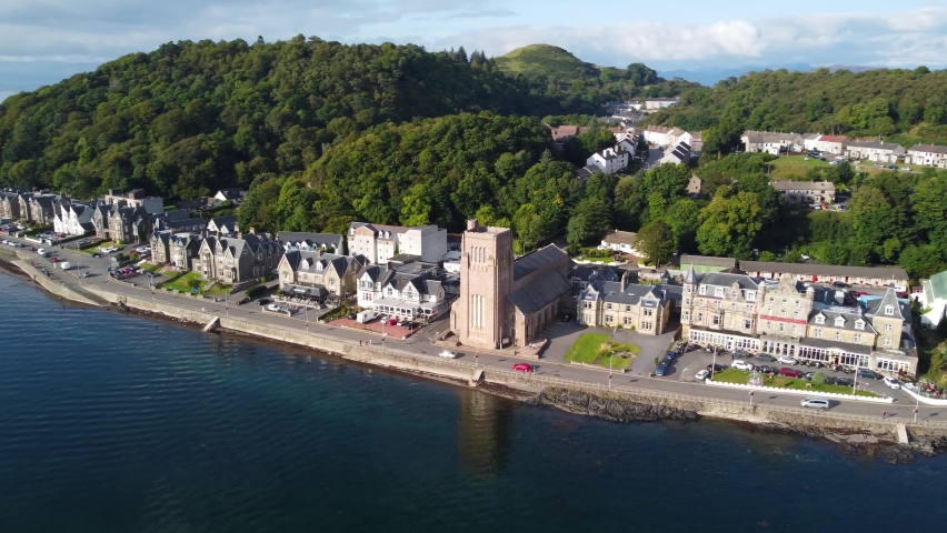 St Columba's Cathedral, Oban Harbour, Seaside Town on West Coast of Scotland, Aerial Drone 4K HD Footage Rotating Royalty-Free Stock Footage #1079125598