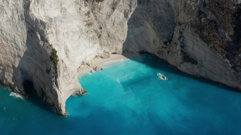 Small Cove Beach With Calm Blue Sea Near Navagio Beach In Zakynthos, Ionian Islands of Greece. - aerial