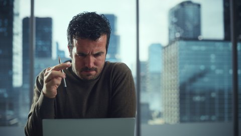 Portrait of Focused Businessman Thinking Hard on Solving Problem in Big City Office. Digital Entrepreneur Trying to Disrupt and Revolutionize Industry, does Data Analysis for e-Commerce Project