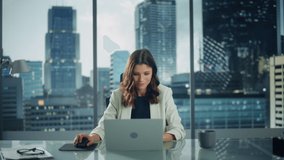Static Portrait of Successful Caucasian Businesswoman Sitting at Her Desk Working on Laptop Computer in Big City Office. Confident Social Media Strategy Manager Plan Disruptive e-Commerce Campaign - Powered by Shutterstock - Get 15% off with code: PIKWIZARD15