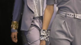 Beautiful female model with bracelet down runway podium. Women on fashionable expo week. Haute couture catwalk, elegant people vogue. Wristband girl catwalks on fashion show stage, person defile look. - Powered by Shutterstock - Get 15% off with code: PIKWIZARD15