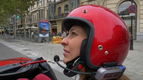 Barcelona , Spain - 10 01 2018: Young woman going around Barcelona's city centre on a sidecar