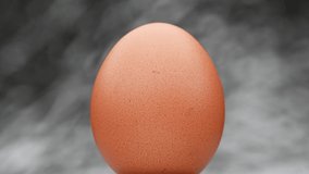 Video 4k and full HD of quality healthy organic egg with eggshell isolated on background.