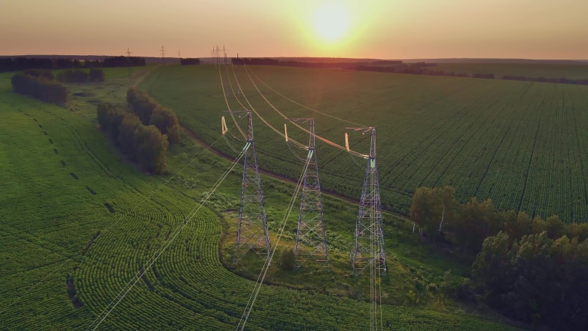 Transmission tower, power tower or electricity pylon, rural infrastructure. High-voltage powerline or overhead power line. Aerial view. Royalty-Free Stock Footage #1079171300