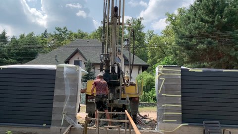 Drilling a water well. A vehicle with a well drilling system. Extraction of water from the ground. Kiev region, Irpin, July 19, 2021