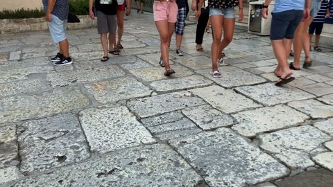 Split, Croatia - July 12 2018: Tourists walking on the stone ground in the Old town of Split, Croatia. Summertime. 