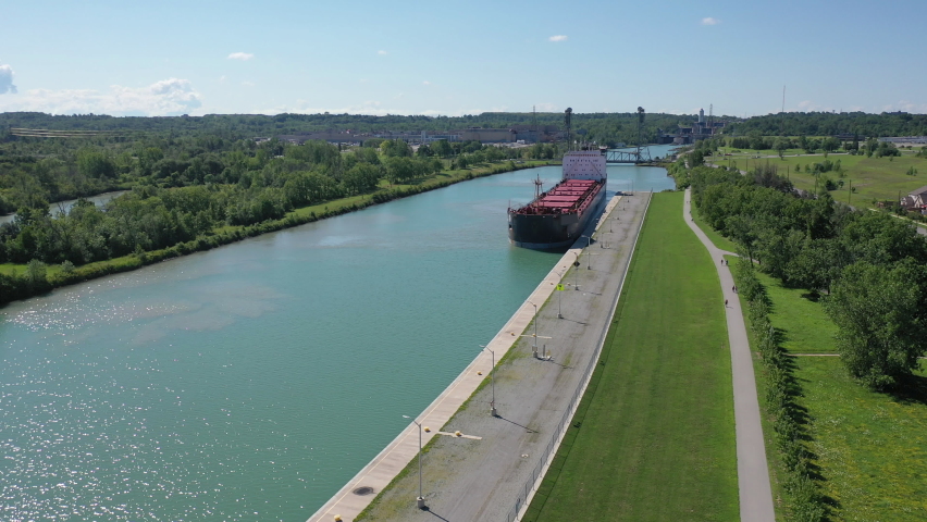 Aerial view of a Lake Freighter sailing in the Welland Canal, Canada 4K