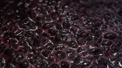 Dark red blackcurrants are boiled in sugar syrup, turning into a healthy jam.