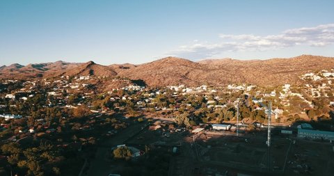 Windhoek, Khomas Region, Namibia, 12.01.20: 4K summer afternoon aerial editorial footage of large construction site with tall cranes in Windhoek, the capital of Namibia, southern Africa