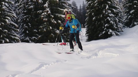 Samoens Refuge de Bostan , Haute Savoie , France - 02 15 2021: Action view of skiing man sliding downhill and turning in snow