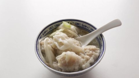 Chinese dumpling food, homemade wonton soup with scallion on top