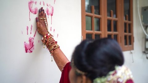 Indian bride handprint on wall Ritual, Hindu Wedding tradition close up
