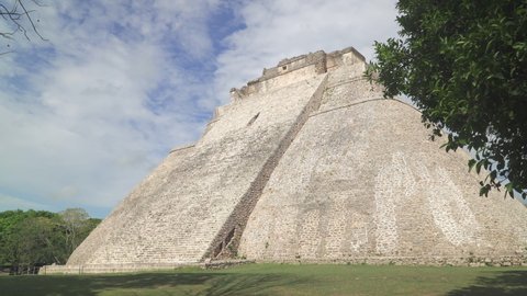 UXMAL, MEXICO - CIRCA 2021: The Pyramid of the Magician, the central landmark of Uxmal, an ancient Mayan city in Yucatan state of Mexico