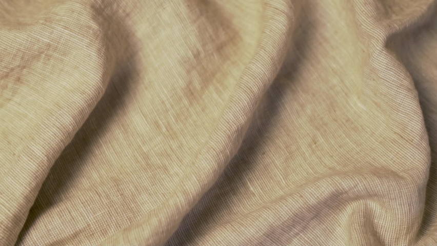 Structure Of Beige Linen Fabric. Linen Material. Background of Linen Fabric of Blanket, Bedspread, Clothes. Clothing Factory, Textile Industry. Royalty-Free Stock Footage #1079232698